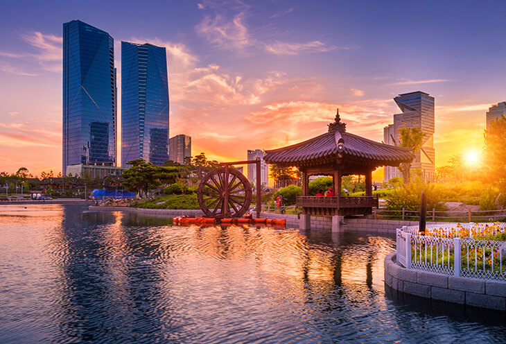 Sunset in South Korea. Two skyscrapers and a lake near LG Science Park