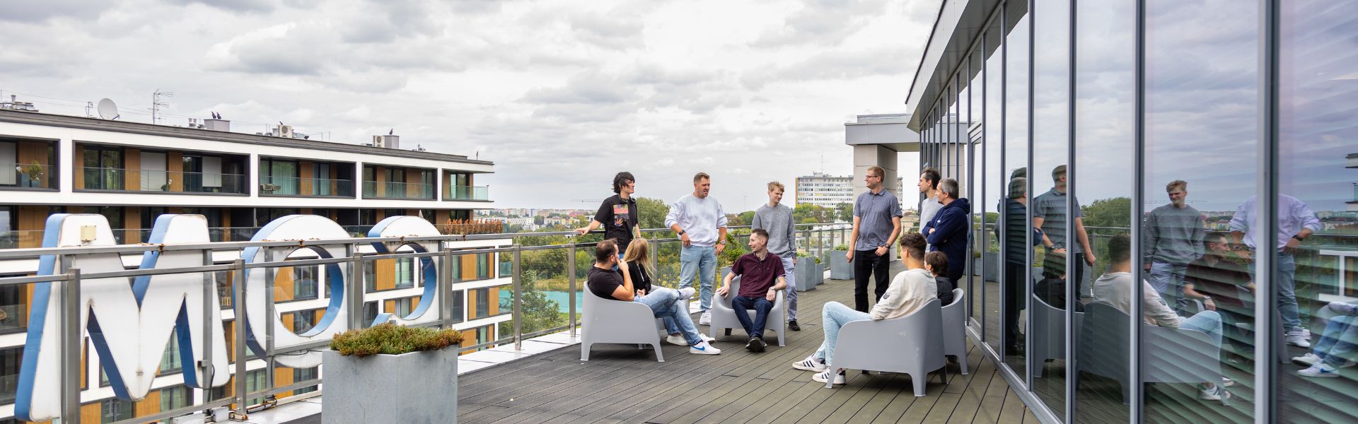 Comarch team enjoying time together at the roof of the Lublin office