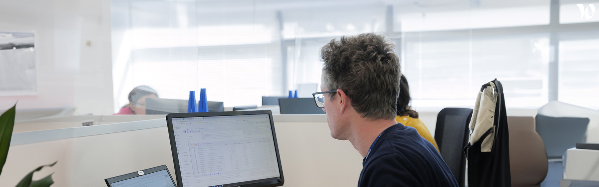 Employee looking at the screen in the office.