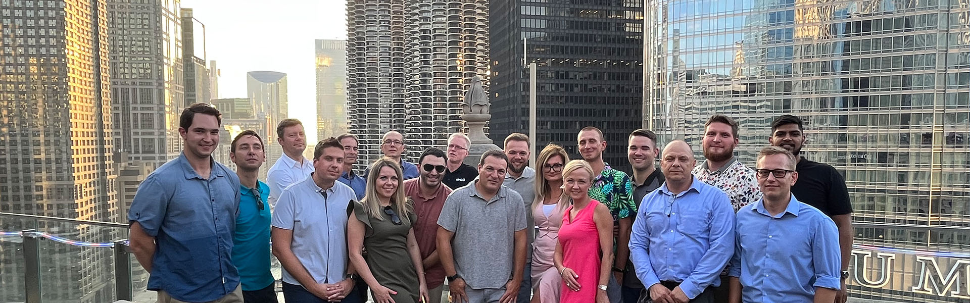 People posing between buildings.