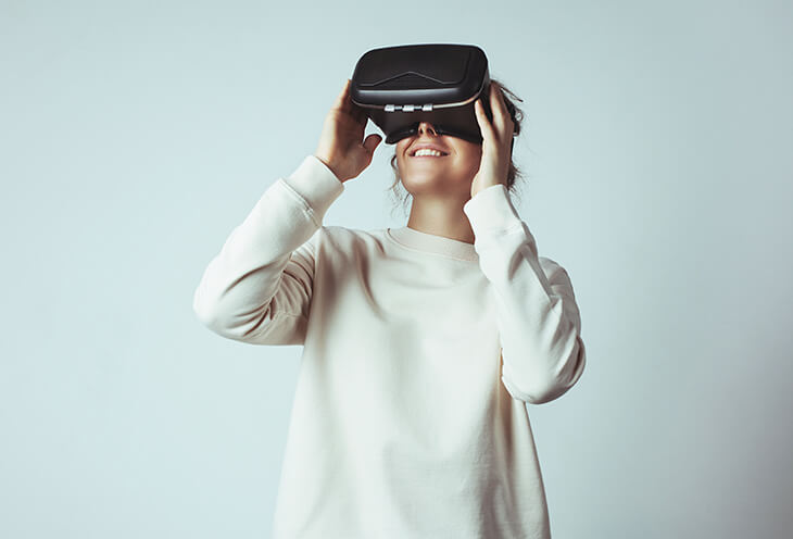 The woman is playing with VR glasses on her head. This is the design of the user interface