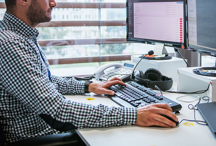 Comarch programmer works at the computer.