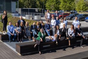 A group of comarch employees posing to the picture and enjoying the sunny weather in Krakow