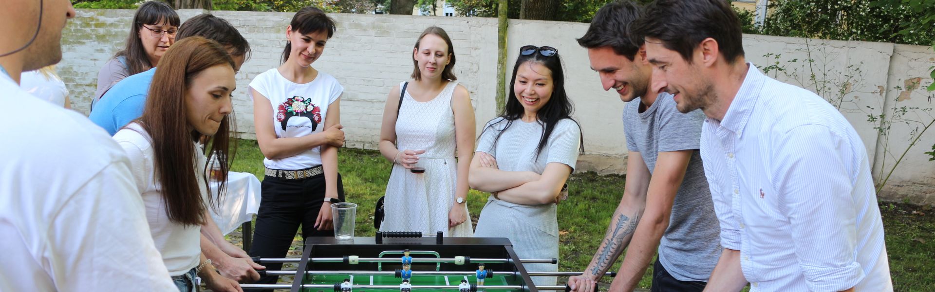 dresden team playing table footbal during the integration party