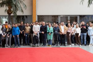 Comarch interns posign for a group picture with Comarch's CEO